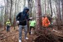 UNH student volunteers cleaning up College Woods on Durham campus